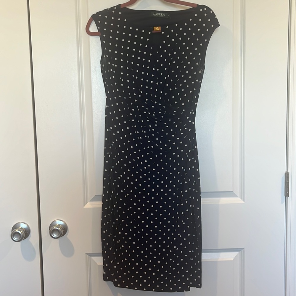 Size 4 women’s dress, navy blue and white with classic polka dot pattern.